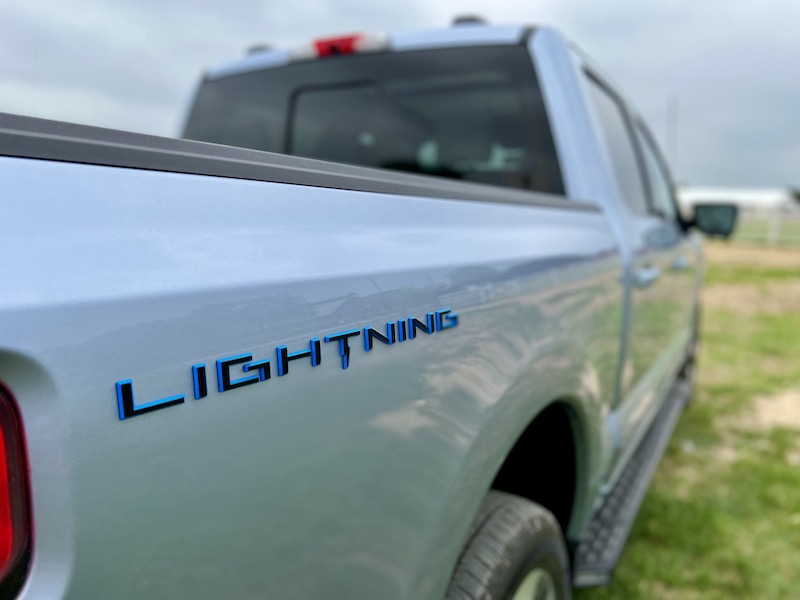 The Lightning logo on the side of the bed is one of the few indicators that this truck is electric