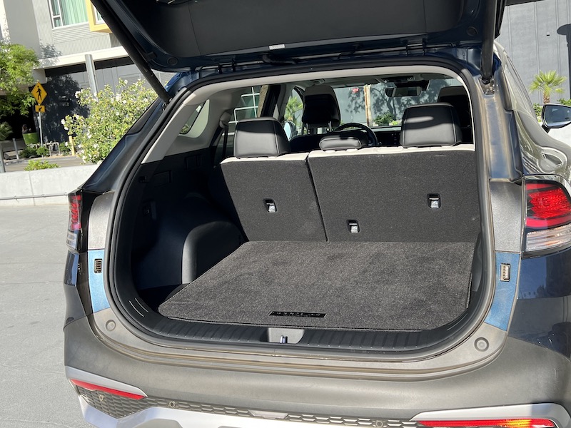 The rear cargo area which has a spare tire under the cargo floor