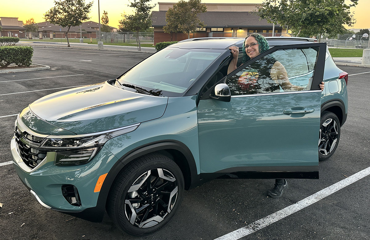 Featured Image - Liv Leigh Smiles While Hopping Into The 2024 Kia Seltos Sx Turbo Safest Cars On The Road Upside Down Car Loan Best Suv Under $30,000