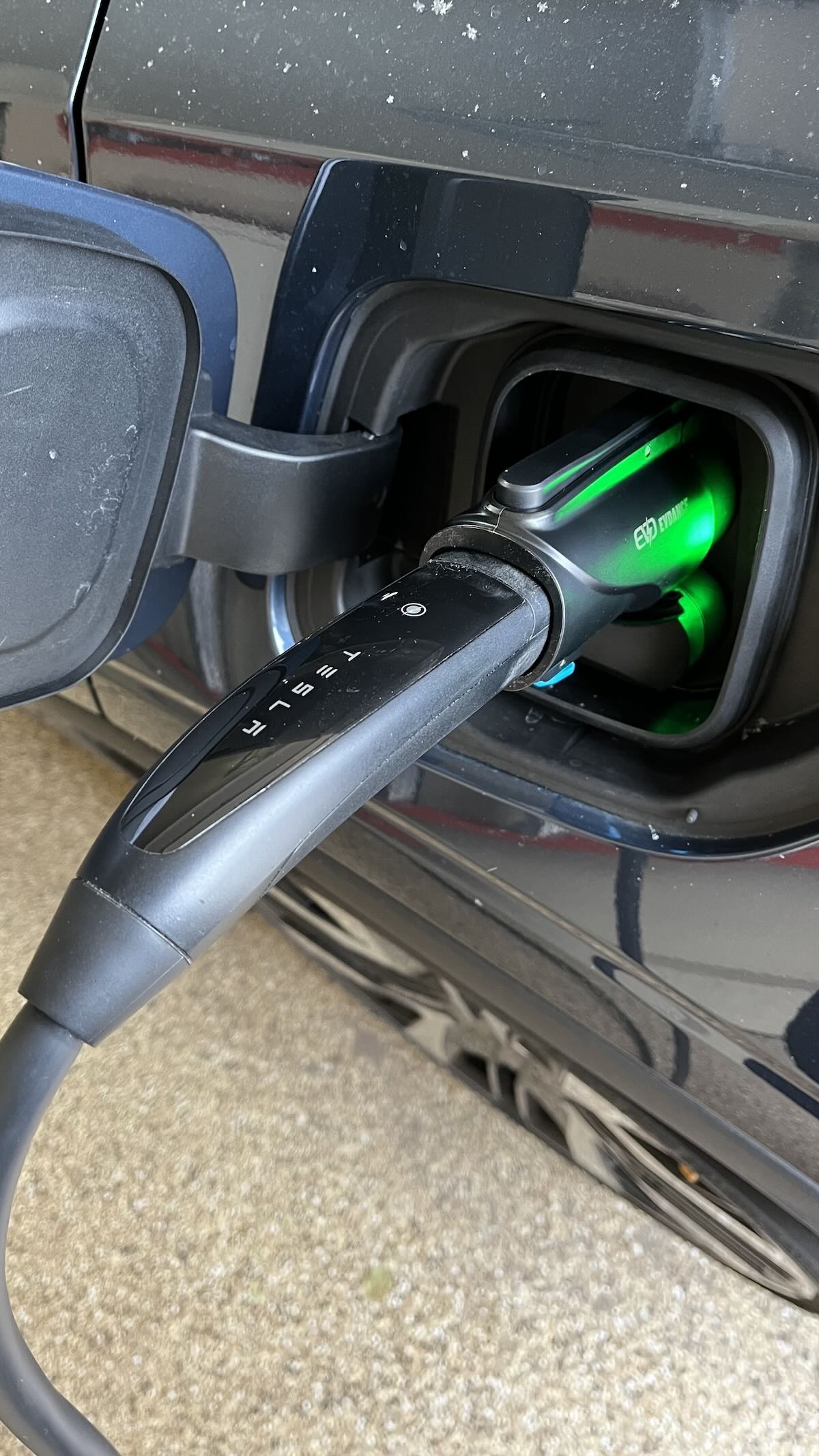 Tesla Connector With Adapter Attached, Charging A Polestar 2. Photo: Sara Lacey