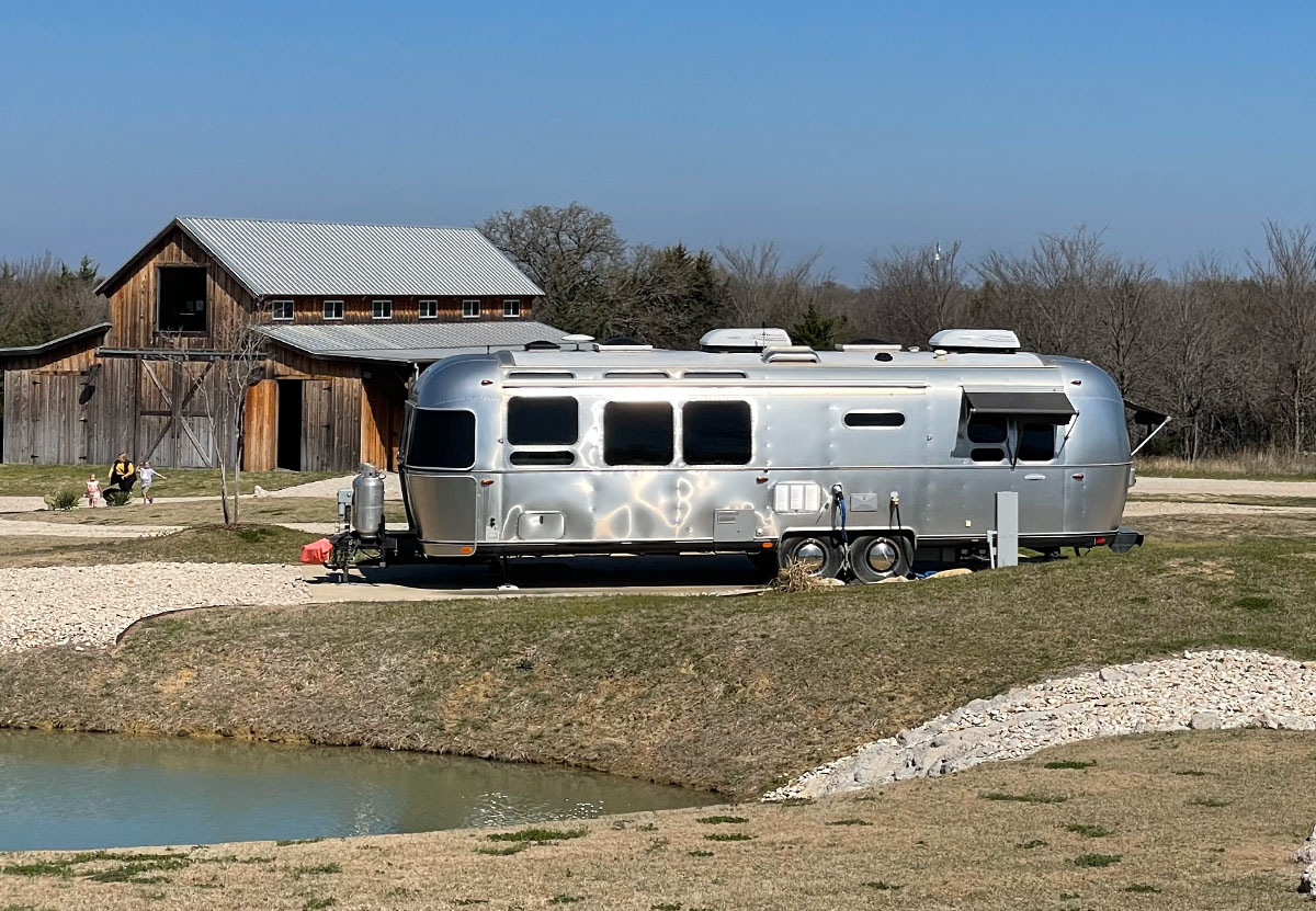 A Girls Guide To Cars | Find Yourself Pining For Adorable, Instagramable Travel In An Airstream? - Trade Wind Travel Trailer At Campground