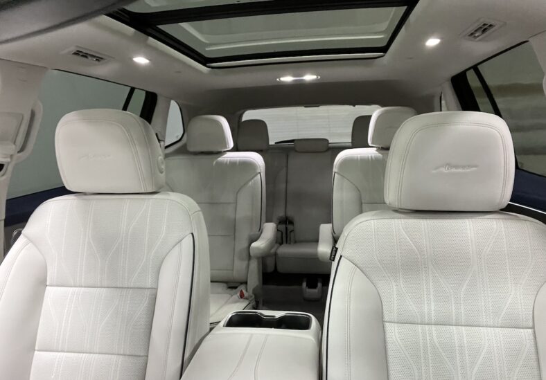 The White Leather And Panoramic Sunroof Create A Light And Refined Space