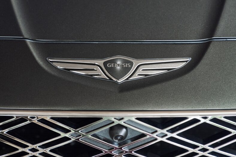 The New Storr Green Color Surrounding The Genesis Gv80 Badge