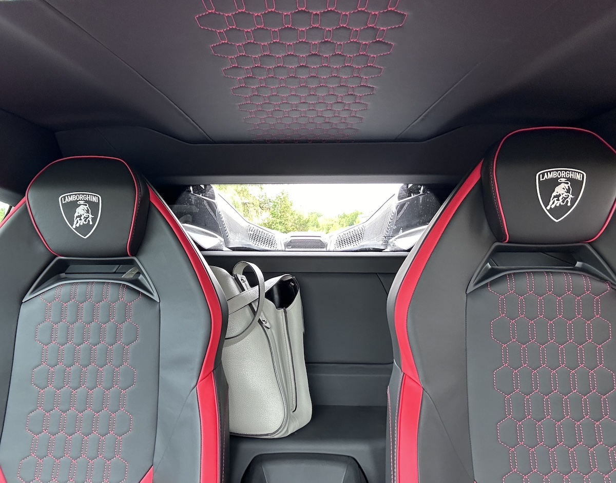 The Interior Of The Lamborghini Revuelto Has A Shelf That Made Bring A Handbag And A Jacket Convenient