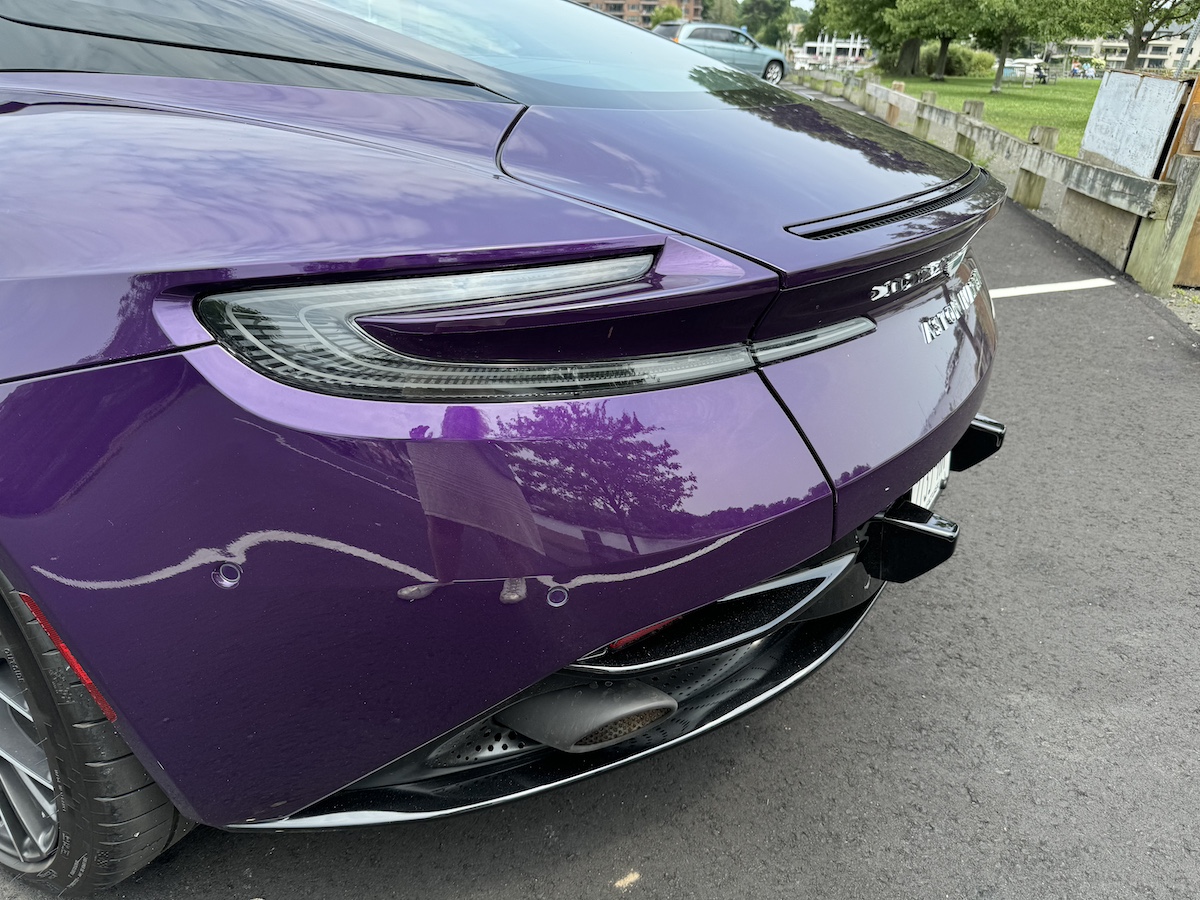 Driving the Aston Martin DB12, a Powerful, Modern Super Tourer, Will Leave You Feeling Regal 15 The Rear Of The 2024 Aston Martin Db12 Shows The Iconic Tail Lights And Spoiler