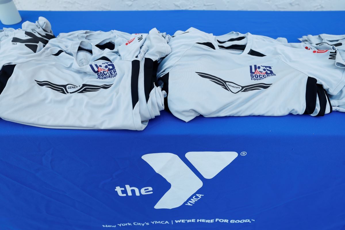 Commemorative Jerseys Are Given To Young Athletes Who Played On The New Genesis Gives Mini-Pitch In Staten Island, Ny