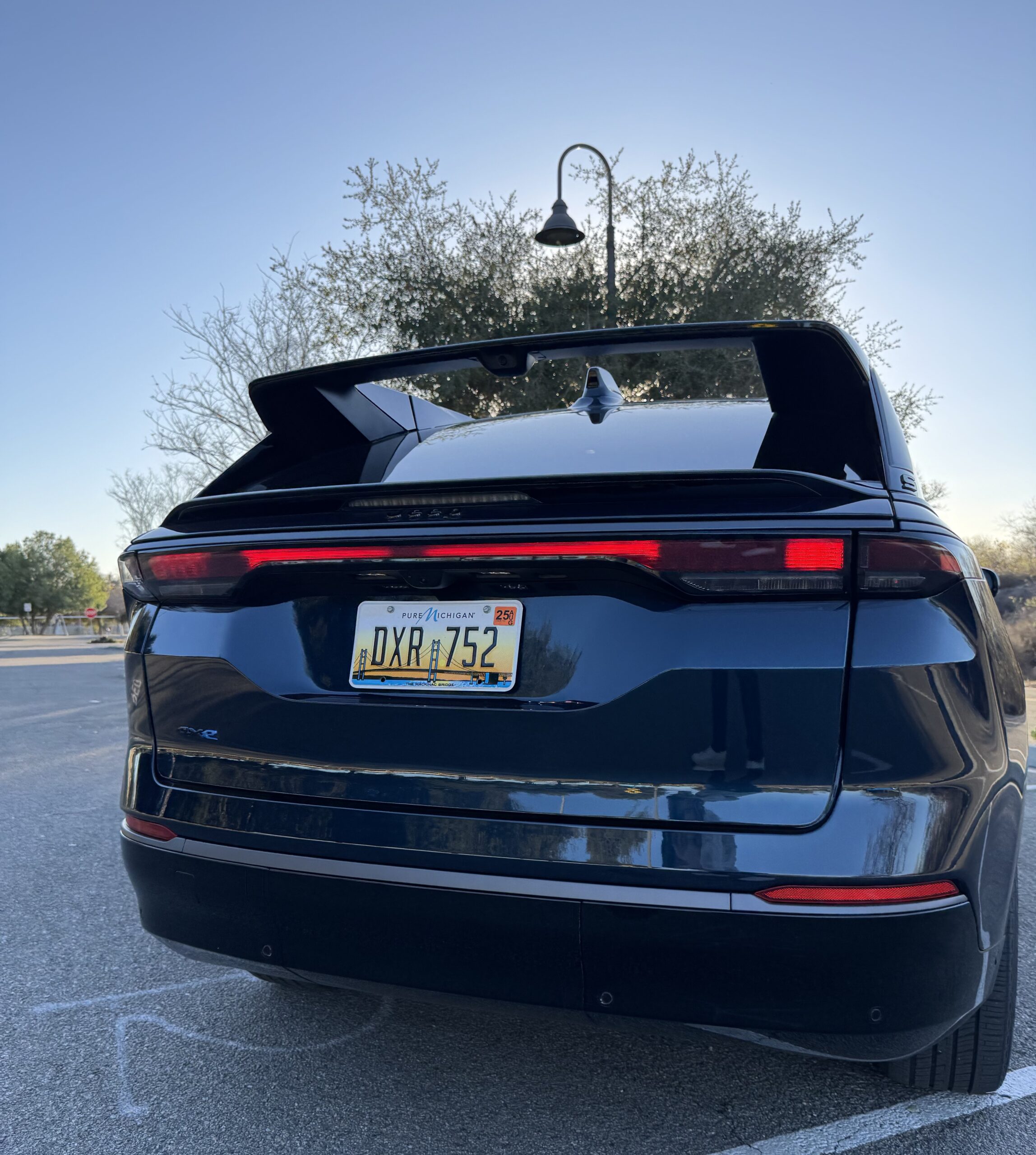 The Rear End With The Large Rear Wing Of The Jeep Wagoneer S
