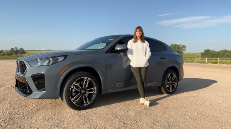 Sara Lacey Standing Next To The Bmw