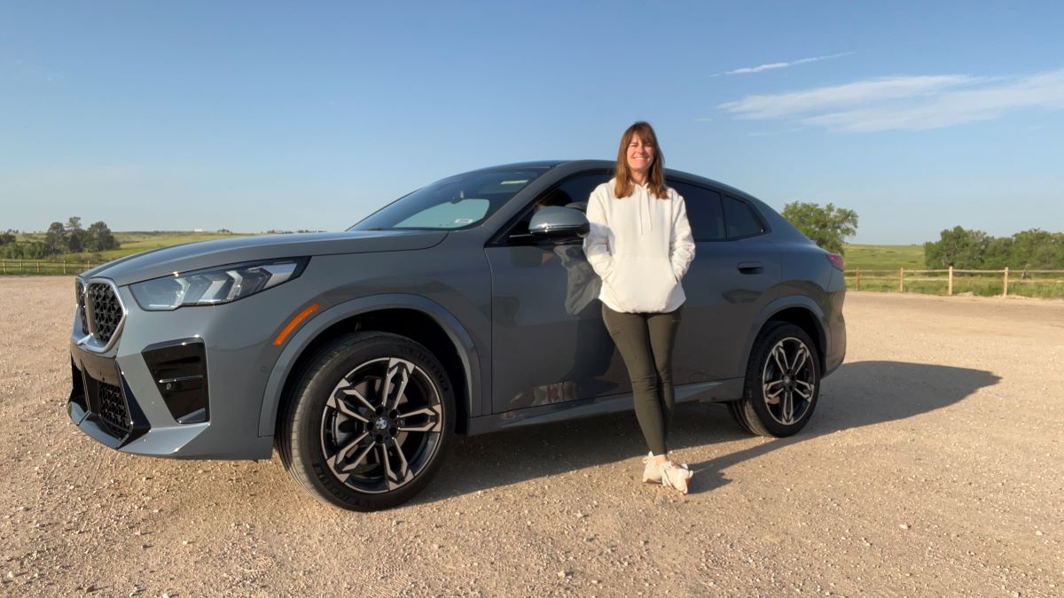 Sara Lacey Standing Next To The Bmw