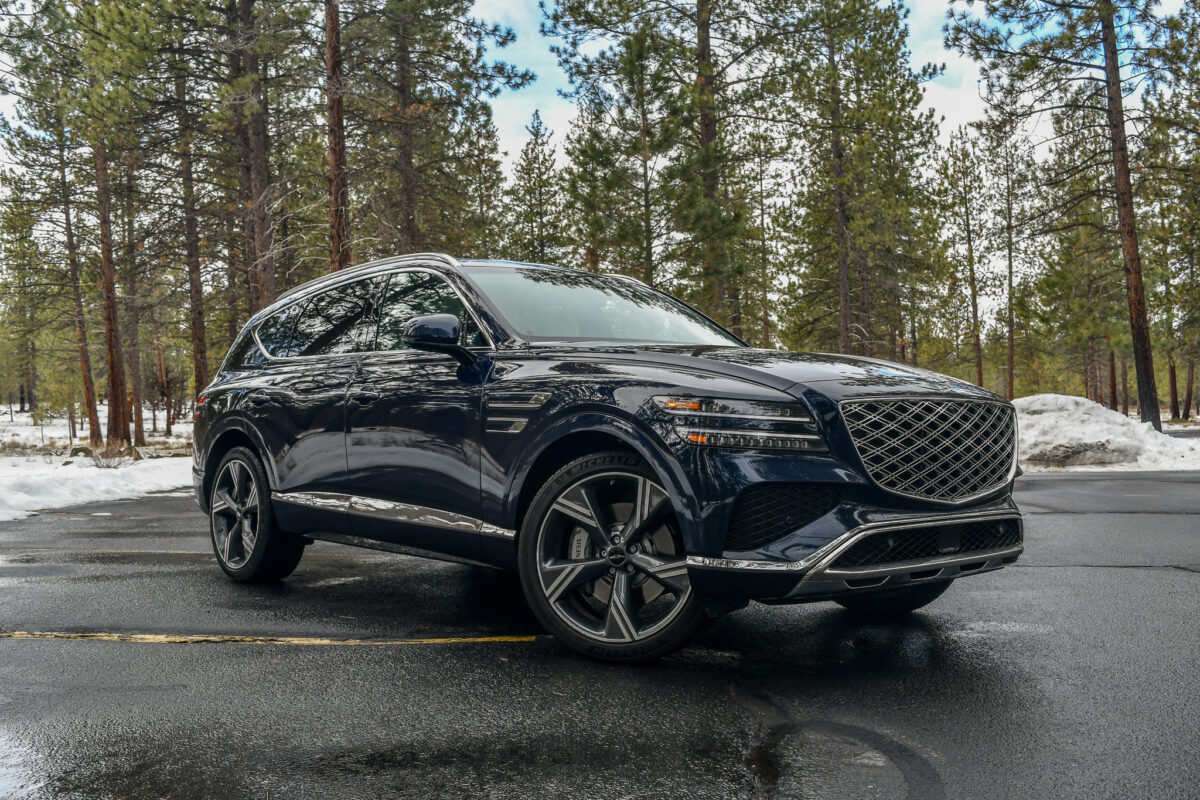 The 2024 Genesis Gv80 In A Wooded Parking Lot
