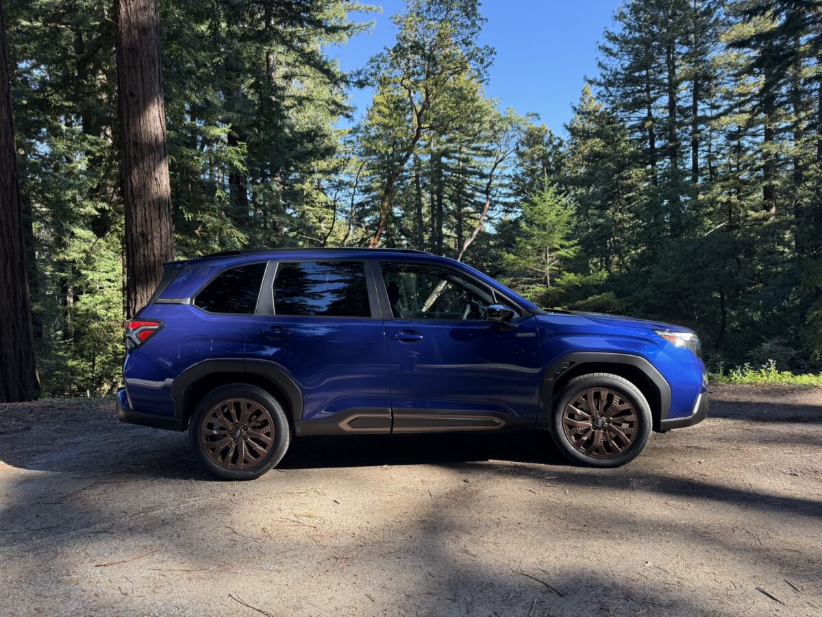 The 2025 Subaru Forester Hybrid Is At Home Among the Trees—and Muddy Hills and Rutted Roads 9 The Side Profile Of The 2025 Subaru Forester Hybrid Parked In A Wooded Area