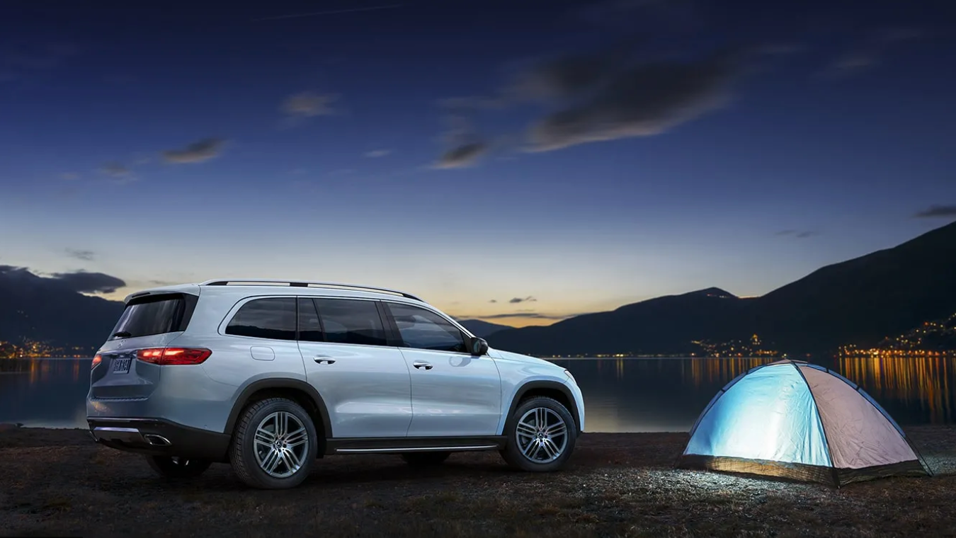 Buy This Not That: Best Luxury SUVs—and the Worst—For Families Who Need 7 Seats 7 The Mercedes Amg Gls Suv Parked Next To A Riverside Tent