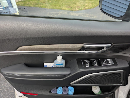 I'm a Traveling Nurse. This is How I Organize My 2022 Kia Telluride For Work and Family 5 A Bottle Of Hand Sanitizer In The Driver'S Side Door Of My 2022 Kia Telluride