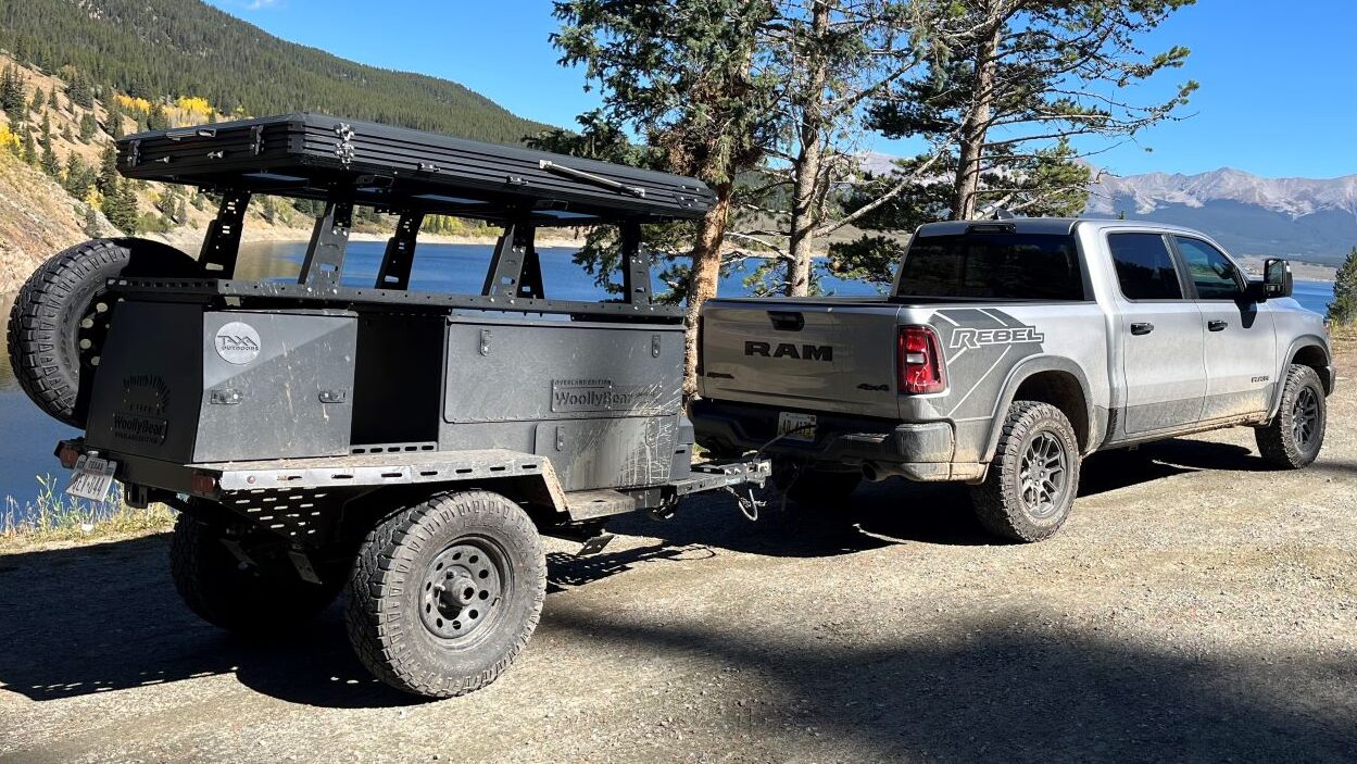 7 Reasons I Choose Cars with AWD or 4WD— And You Can't Make Me Feel Bad About It 9 The Ram Rebel Towing The Taxa Woolly Bear Camping Trailer, Parked Near A Lake