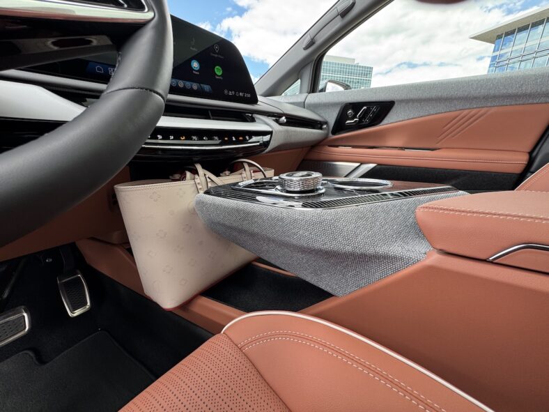 Cadillac Optiq, Including the Thrill of V Power, Is Your Invitation to the Modern Luxury of EVs 9 My Handbag Fit Nicely Between The Floating Center Console And The Dash In The Cadillac Optiq