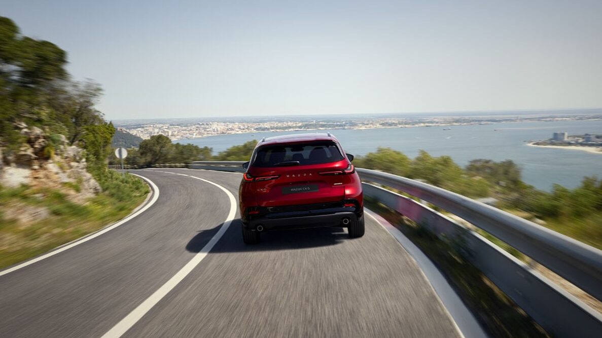 6 Things That Make The 2026 Mazda CX-5 the Best Ever, and One That, Thankfully, Is Unchanged 8 The Rear End Of The Mazda Cx-5 On A Coastal Highway