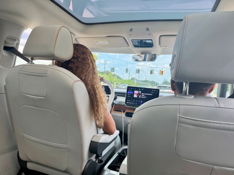 The View Of The Driver'S Seat From The Second Row'S Captain'S Chair