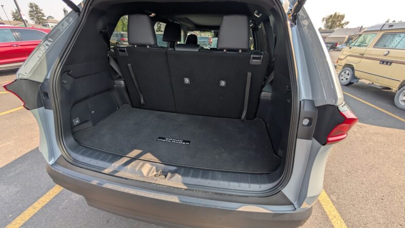 The Trunk Of The 2025 Toyota Grand Highlander Nightshade Hybrid With The Third-Row In Use