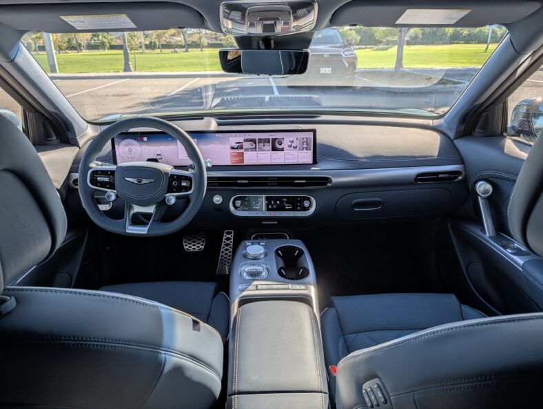 The Interior Of The 2026 Genesis Gv60, Showcasing The Driver'S Footwell