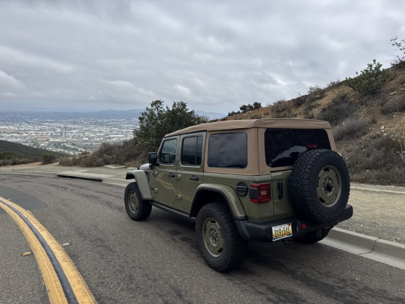 The 2025 Jeep Wrangler 4xe Was Made to Off-Road, But It's a Perfect Fit For Beach Life 11 The Rear Quarter Of The 2025 Jeep Wrangler 4Xe Willys In Front Of A Vista