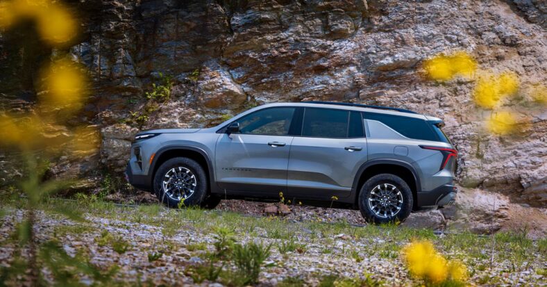 Buy This, Not That: Popular 3-Row SUVs and Their Underrated Alternatives 3 The 2026 Chevy Traverse Zl1 In A Flower Field
